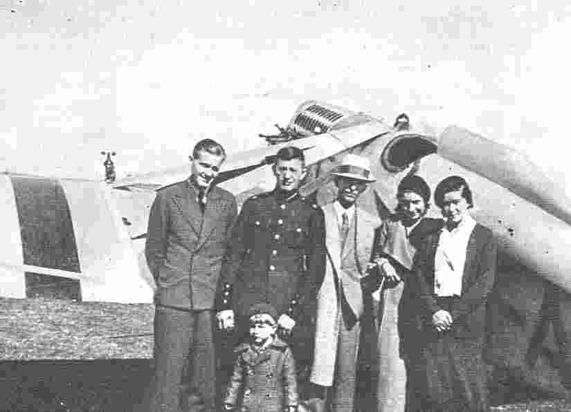 Riga at departure.  Officer in centre is Karlis Konstants, with Cukurs' son Gunars